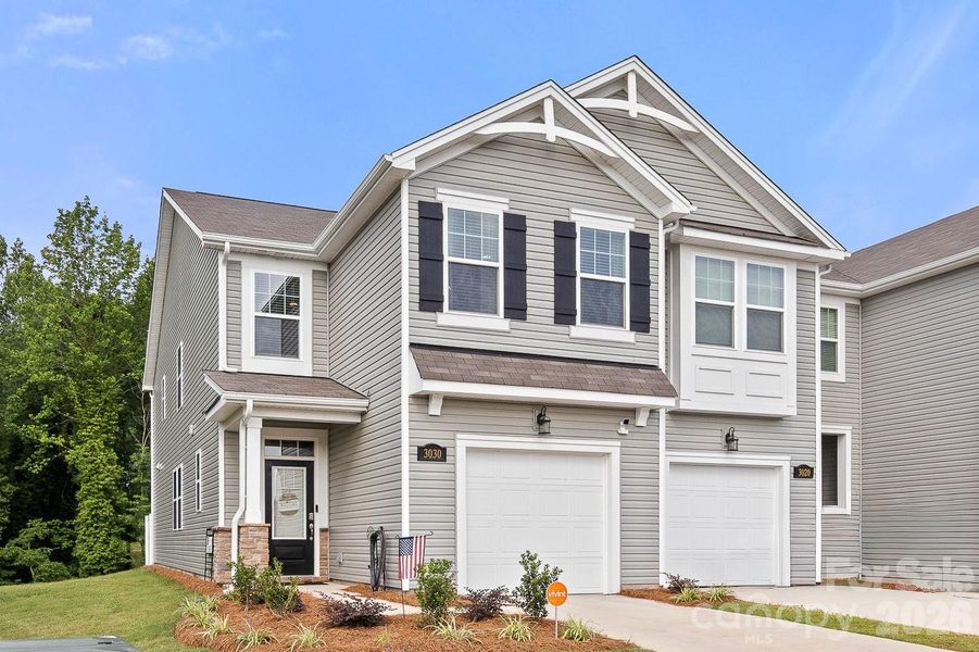 Front exterior of a new home in Hedgecliff Townes, Concord, NC, highlighting curb appeal (Image 1). Front exterior of a new home in Hedgecliff Townes, Concord, NC, highlighting curb appeal (Image 1).