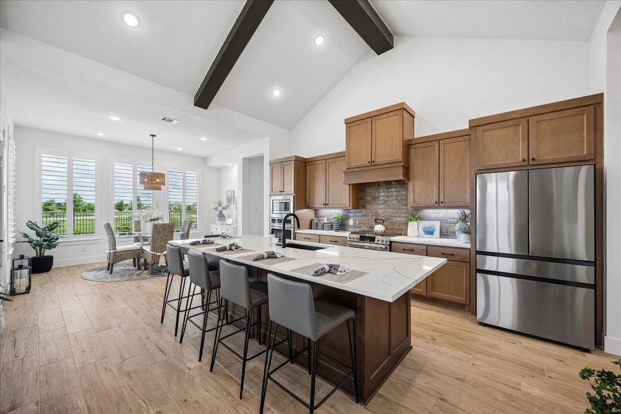 Kitchen and dining area, featuring an open-concept layout and custom finishes.