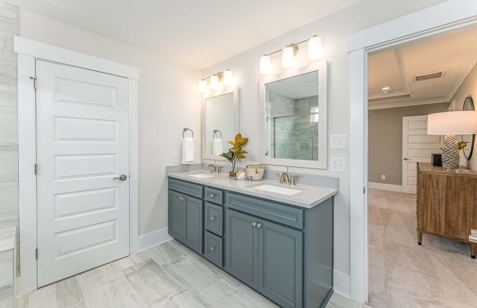Luxury Owner's Bath with dual vanity and tile shower
