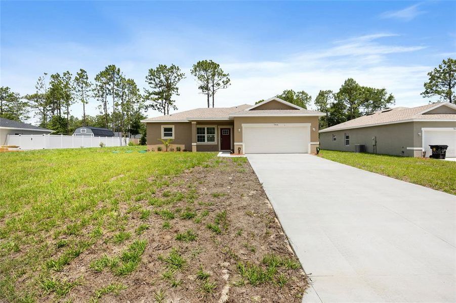Front exterior of a new home in , Citrus Springs, FL, highlighting curb appeal (Image 17).