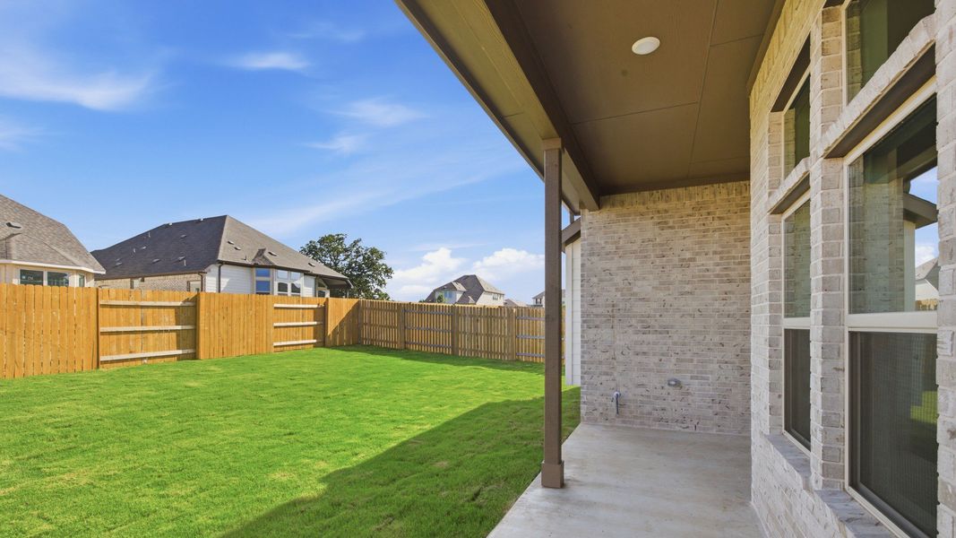 Exterior details and patio area of a home in Oaks at San Gabriel, Georgetown (Image 23).
