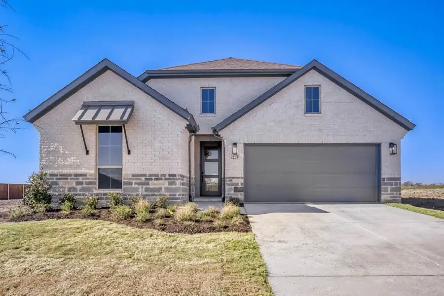 Front exterior of a new home in Meraki, Forney, TX, highlighting curb appeal (Image 2).