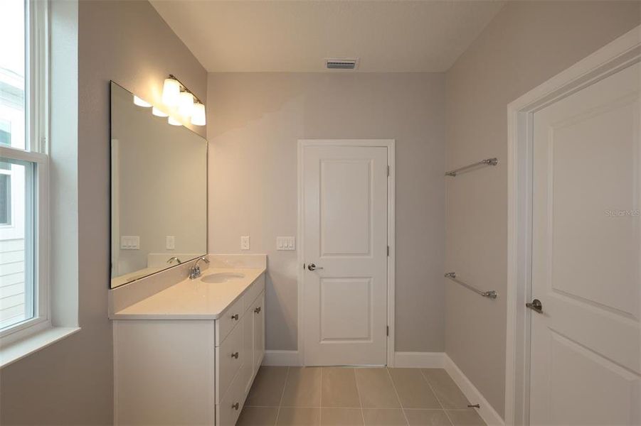 Furnished interior view inside a new home in Lake Star at Ovation, Winter Garden (Image 10).