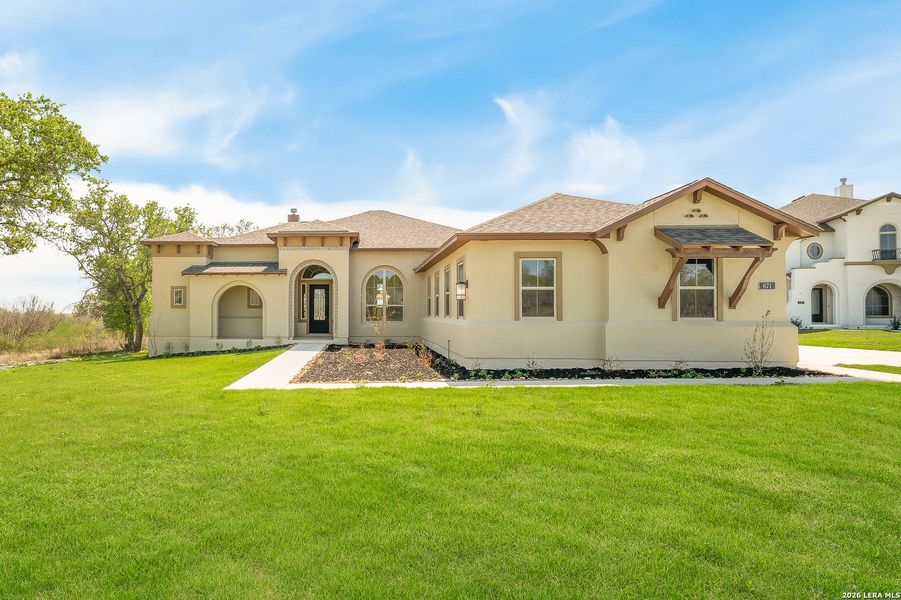 Front exterior of a new home in Legend Park, Castroville, TX, highlighting curb appeal (Image 15).