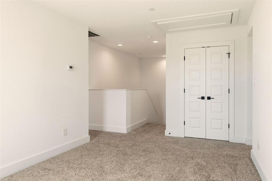 Living Space at top of Stairs with Closet Storage