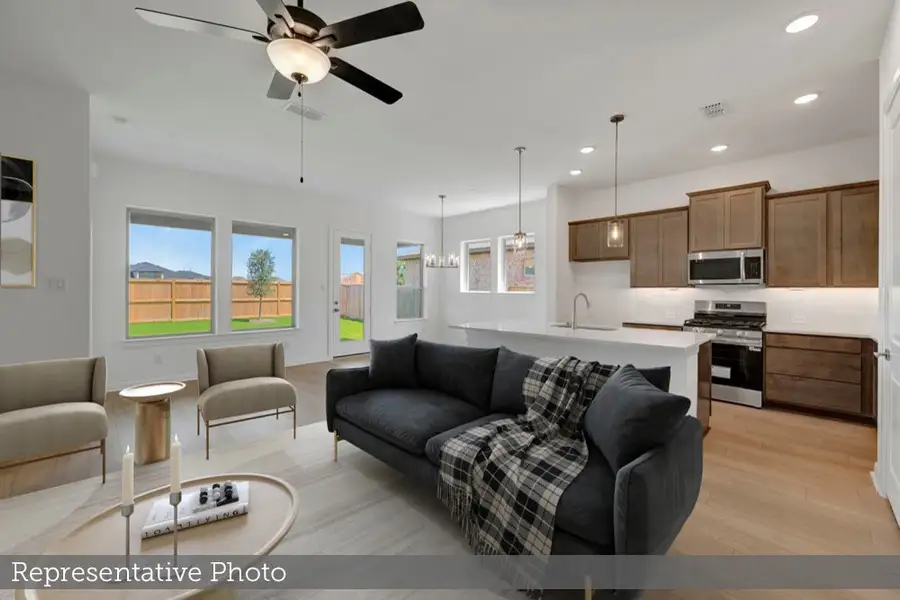 Furnished interior view inside a new home in Meridiana - Terrace Collection, Manvel (Image 6).