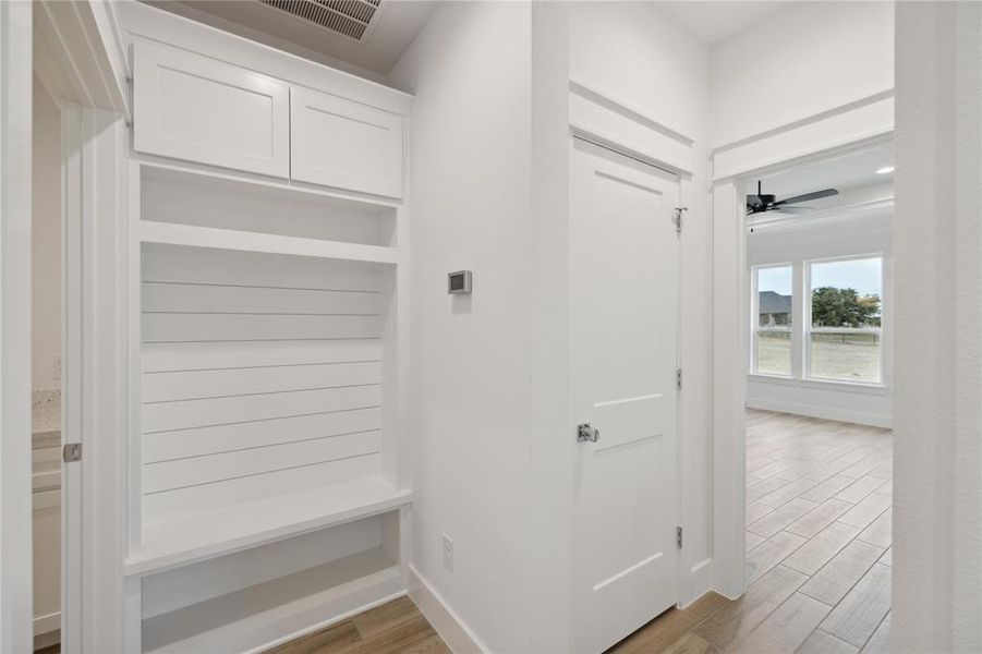 Mudroom featuring ceiling fan and light wood-type flooring