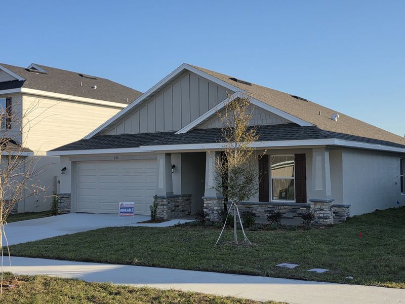 Front exterior of a new home in Arbor Park, Leesburg, FL, highlighting curb appeal (Image 2).