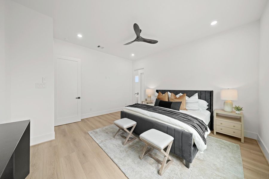 The spacious 16’ x 15’ owner’s suite has room for a sitting area and access to the private bath in the background. The spacious 16’ x 15’ owner’s suite has room for a sitting area and access to the private bath in the background.