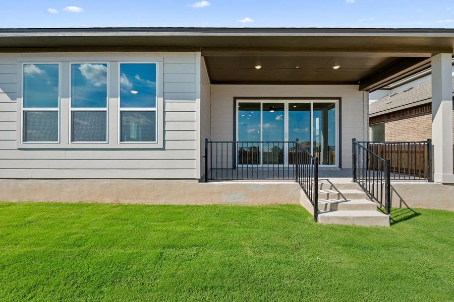 Exterior details and patio area of a home in Lariat, Liberty Hill (Image 25).