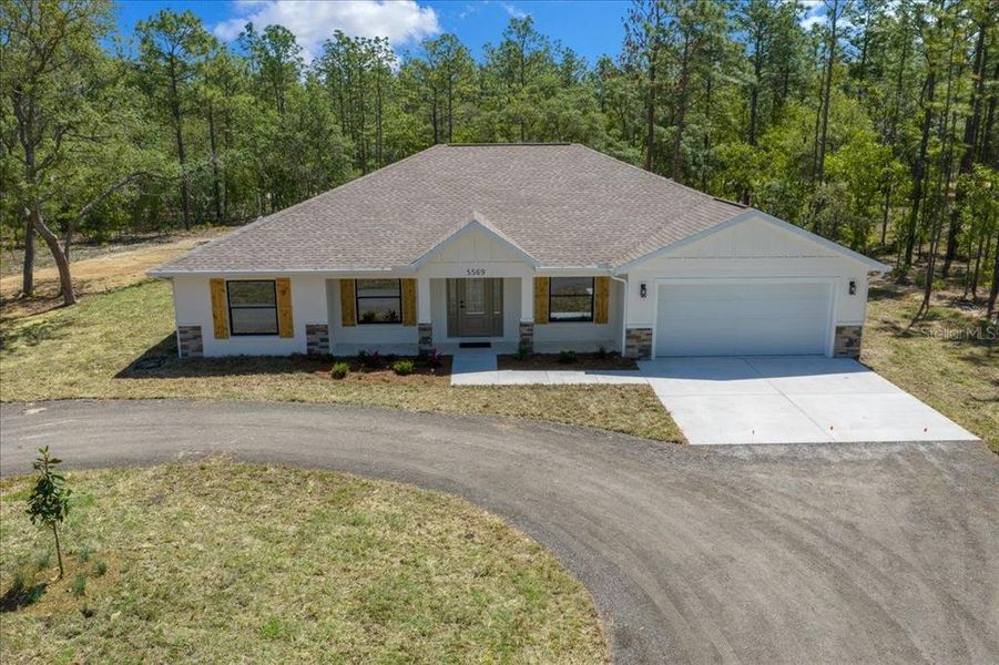 Front exterior of a new home in , Ocala, FL, highlighting curb appeal (Image 28).