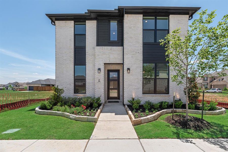 Contemporary home featuring brick siding Contemporary home featuring brick siding