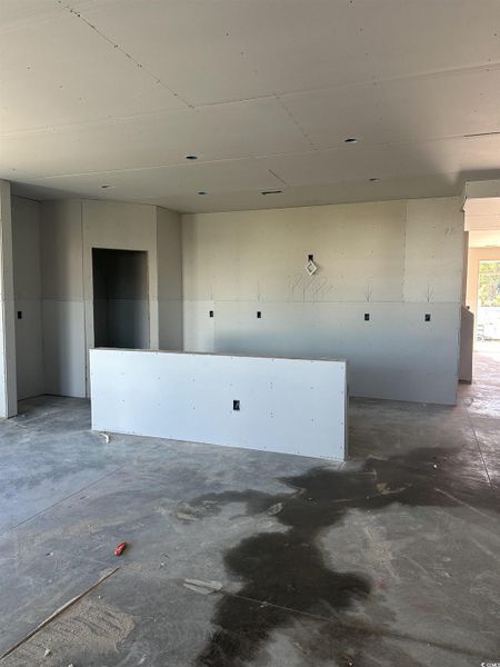 Spare room featuring concrete floors