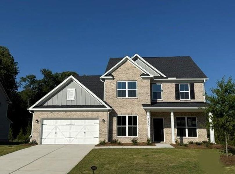 Front exterior of a new home in Oakwood, Cumming, GA, highlighting curb appeal (Image 2). Front exterior of a new home in Oakwood, Cumming, GA, highlighting curb appeal (Image 2).