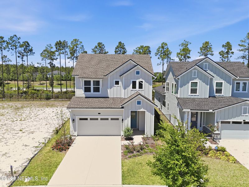 Front exterior of a new home in Crosswinds 40’, Ponte Vedra, FL, highlighting curb appeal (Image 26).