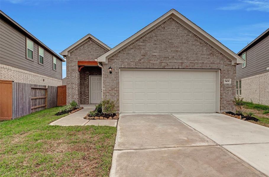Front exterior of a new home in Marvida, Cypress, TX, highlighting curb appeal (Image 1).