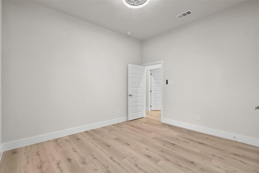 Empty room featuring light wood-type flooring