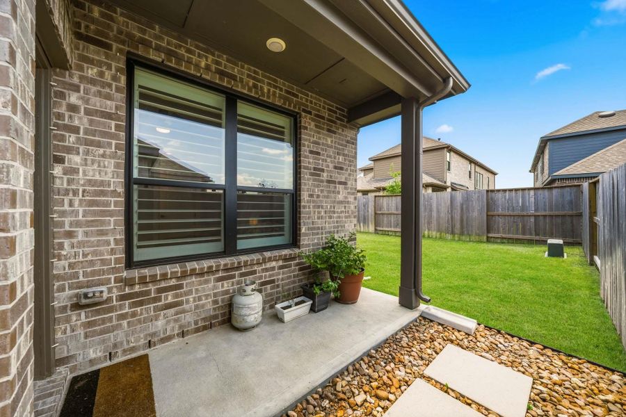 Exterior details and patio area of a home in Meridiana 40', 65', Iowa Colony (Image 3).