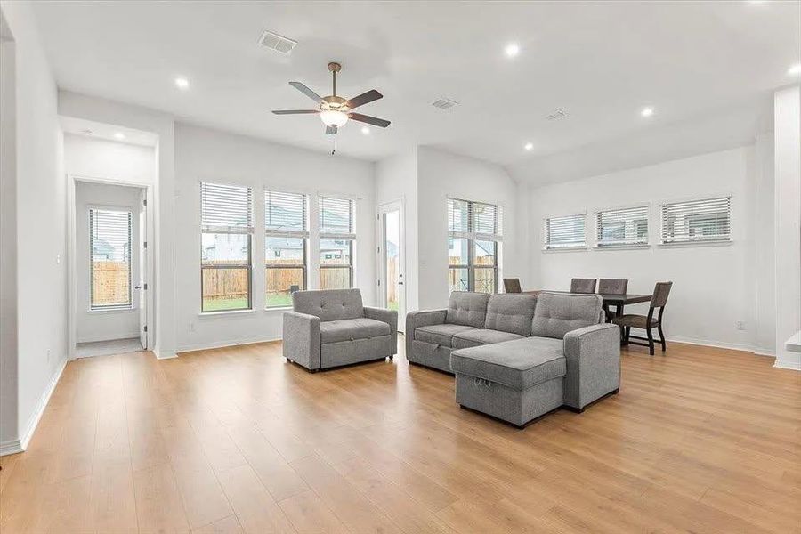 Living area with recessed lighting, light wood-style floors, and ceiling fan Living area with recessed lighting, light wood-style floors, and ceiling fan