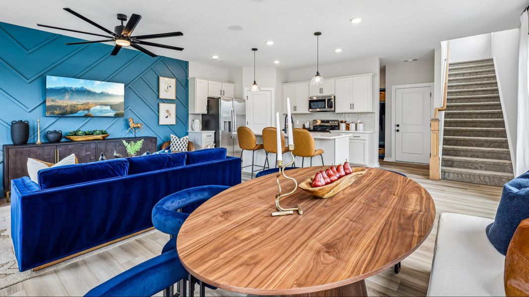 First floor view of gathering room, dining area, and kitchen