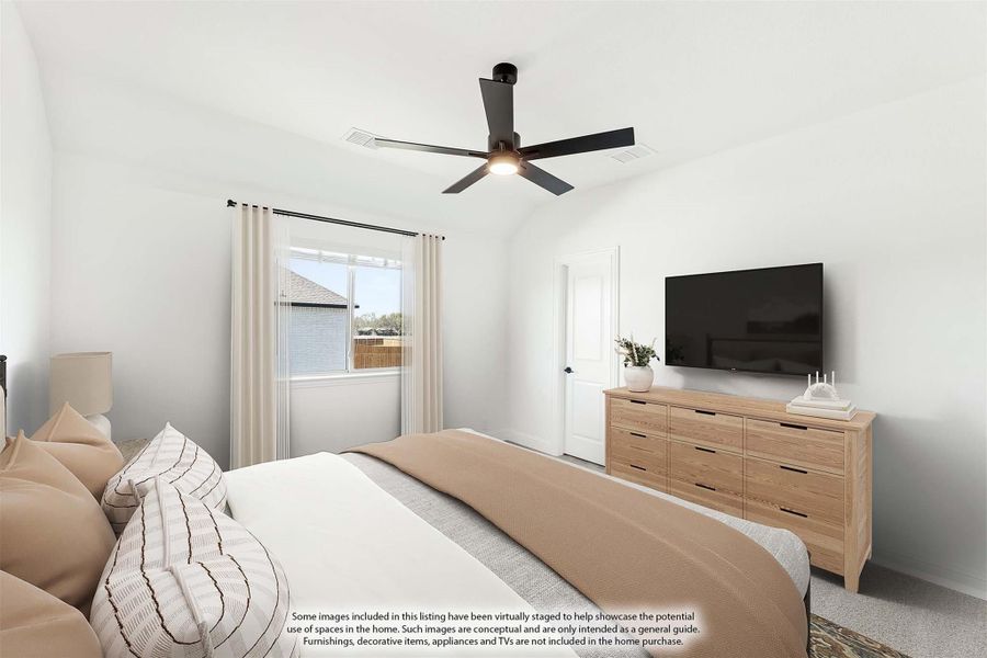 Bedroom with vaulted ceiling, black ceiling fan, wood dresser, and wall-mounted TV Bedroom with vaulted ceiling, black ceiling fan, wood dresser, and wall-mounted TV