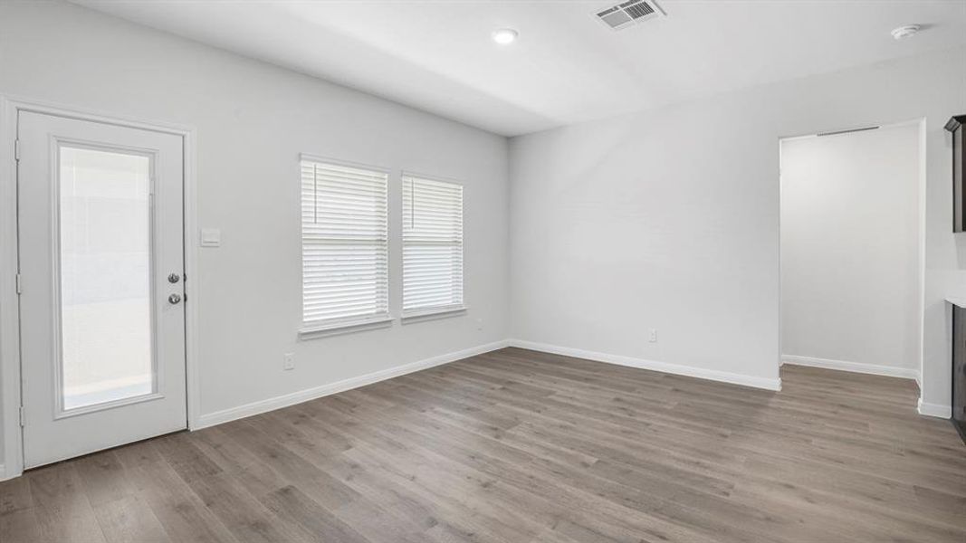 Entryway featuring dark wood-type flooring and recessed lighting