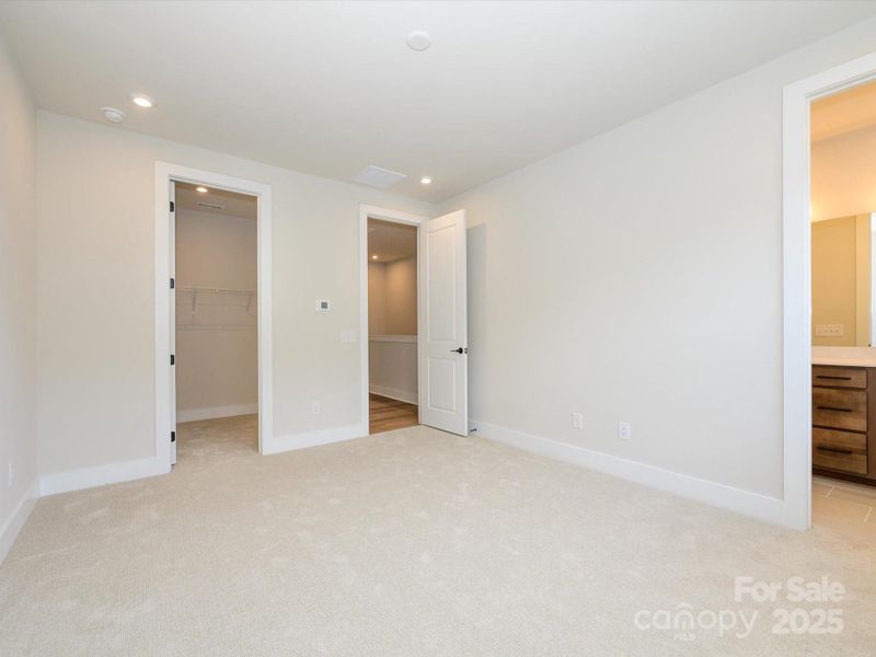 Primary Suite with a Sneak Peak Into the En Suite Bath