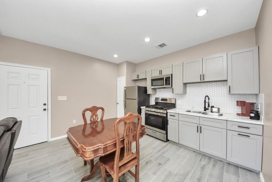 Kitchen, dining,and living area all open concept in ADU/apt