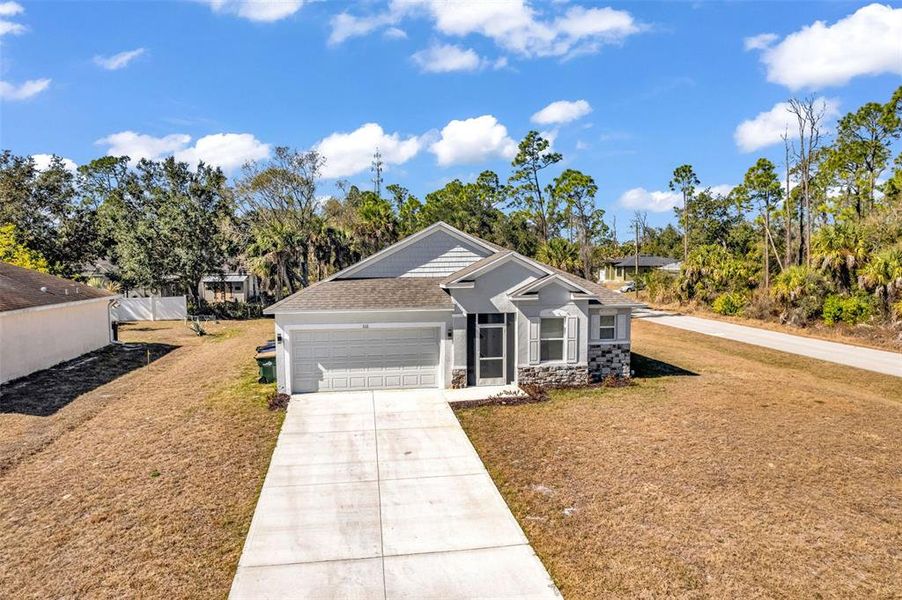 Front exterior of a new home in , North Port, FL, highlighting curb appeal (Image 2).