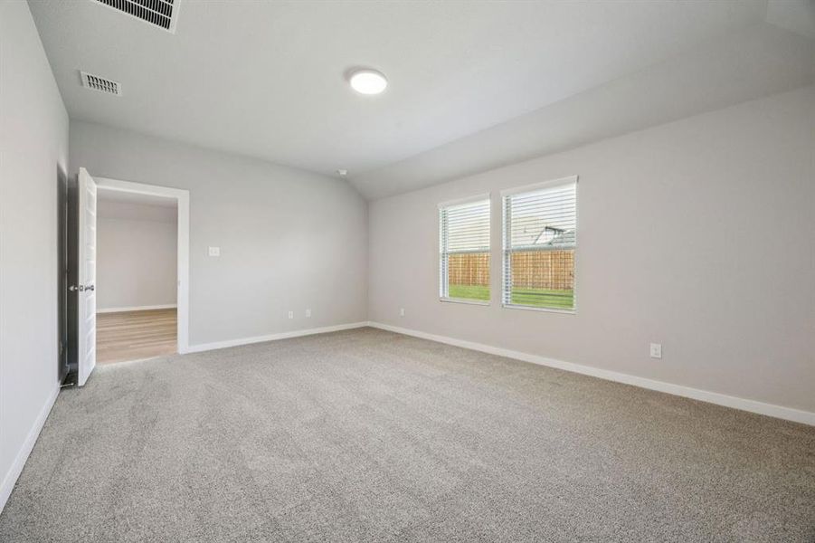 Primary Suite in the Oscar home plan by Trophy Signature Homes – REPRESENTATIVE PHOTO