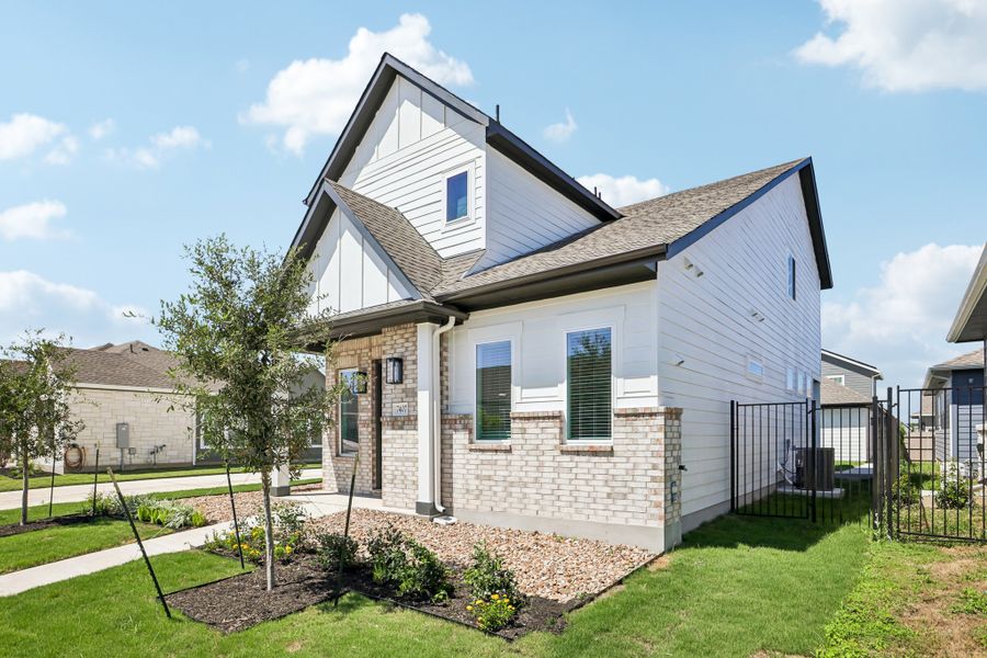 Front exterior of a new home in Easton Park, Austin, TX, highlighting curb appeal (Image 26). Front exterior of a new home in Easton Park, Austin, TX, highlighting curb appeal (Image 26).