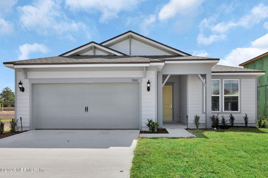 Front exterior of a new home in Hyland Trail, Green Cove Springs, FL, highlighting curb appeal (Image 1). Front exterior of a new home in Hyland Trail, Green Cove Springs, FL, highlighting curb appeal (Image 1).