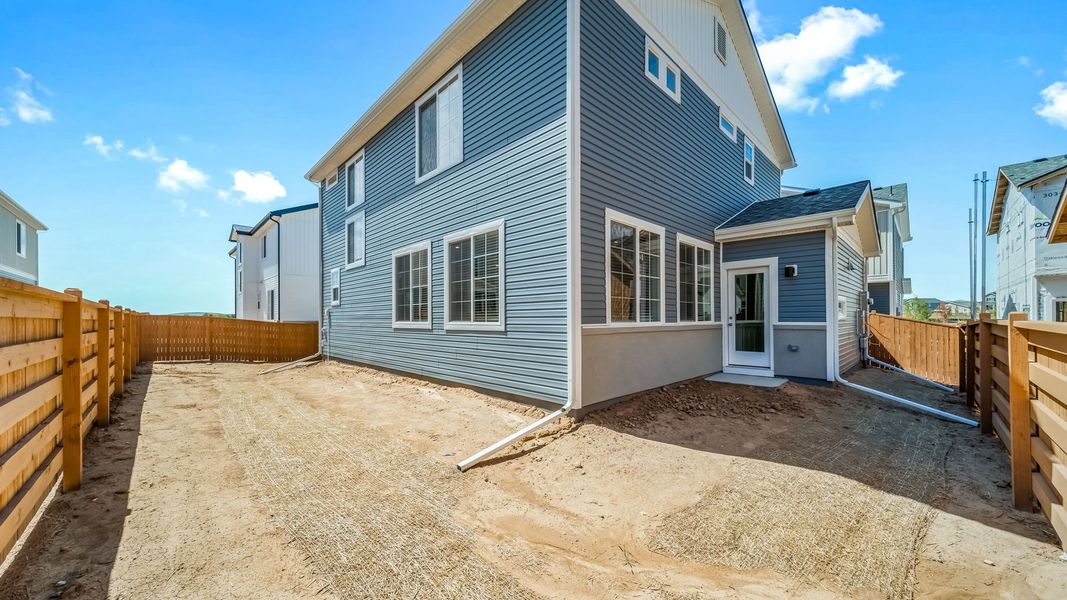Exterior details and patio area of a home in Reunion, Commerce City (Image 21).