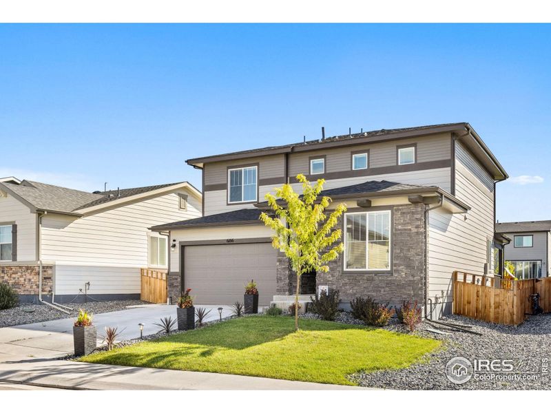 Front exterior of a new home in , Frederick, CO, highlighting curb appeal (Image 2).