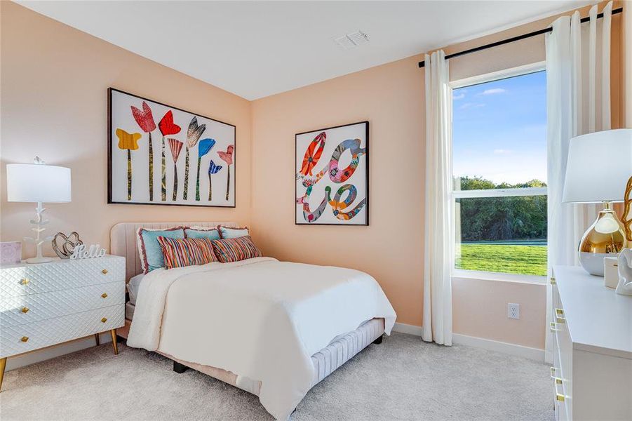 Bedroom with light colored carpet, visible vents, and baseboards