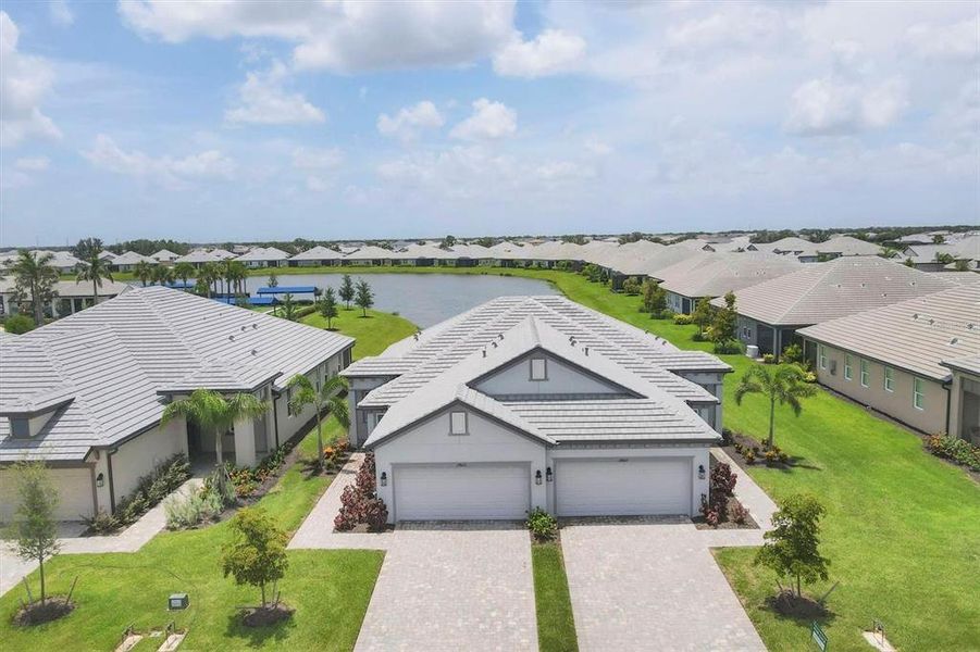Front exterior of a new home in Sweetwater at Lakewood Ranch, Bradenton, FL, highlighting curb appeal (Image 27).