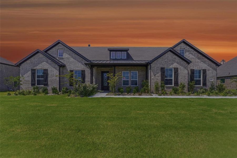 Contemporary ranch-style home featuring a gray brick exterior, dark gabled roofline, and front-facing dormer window Contemporary ranch-style home featuring a gray brick exterior, dark gabled roofline, and front-facing dormer window