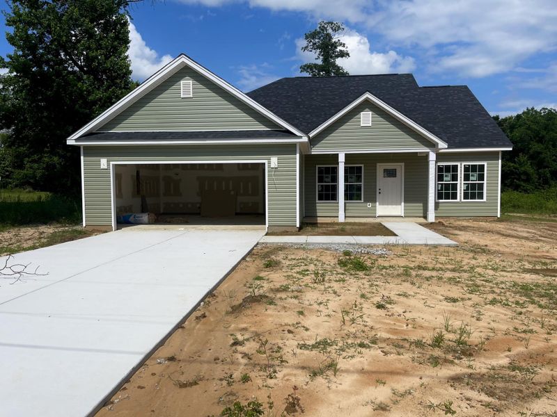 Front exterior of a new home in , Orangeburg, SC, highlighting curb appeal (Image 9).