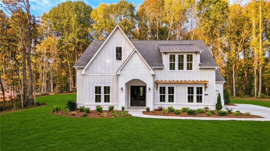 Front exterior of a new home in , Cumming, GA, highlighting curb appeal (Image 21).