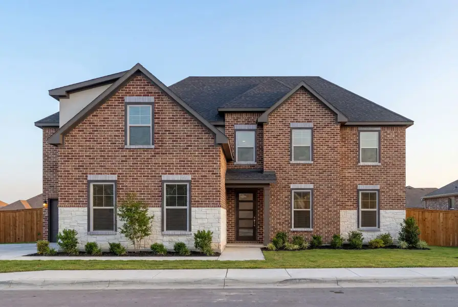 Representative exterior photo of a completed home built from the The Ashford F by Davidson Homes LLC in Potranco Oaks, Castroville, TX (Image 1). Representative exterior photo of a completed home built from the The Ashford F by Davidson Homes LLC in Potranco Oaks, Castroville, TX (Image 1).