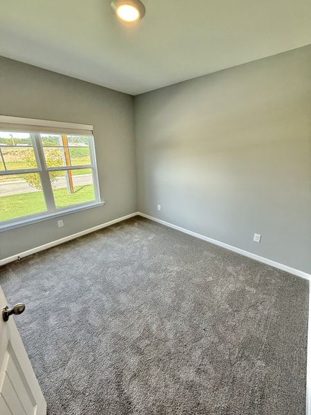 Spacious, unfurnished interior of a new home in Stone Fort Meadows, Manchester (Image 10).
