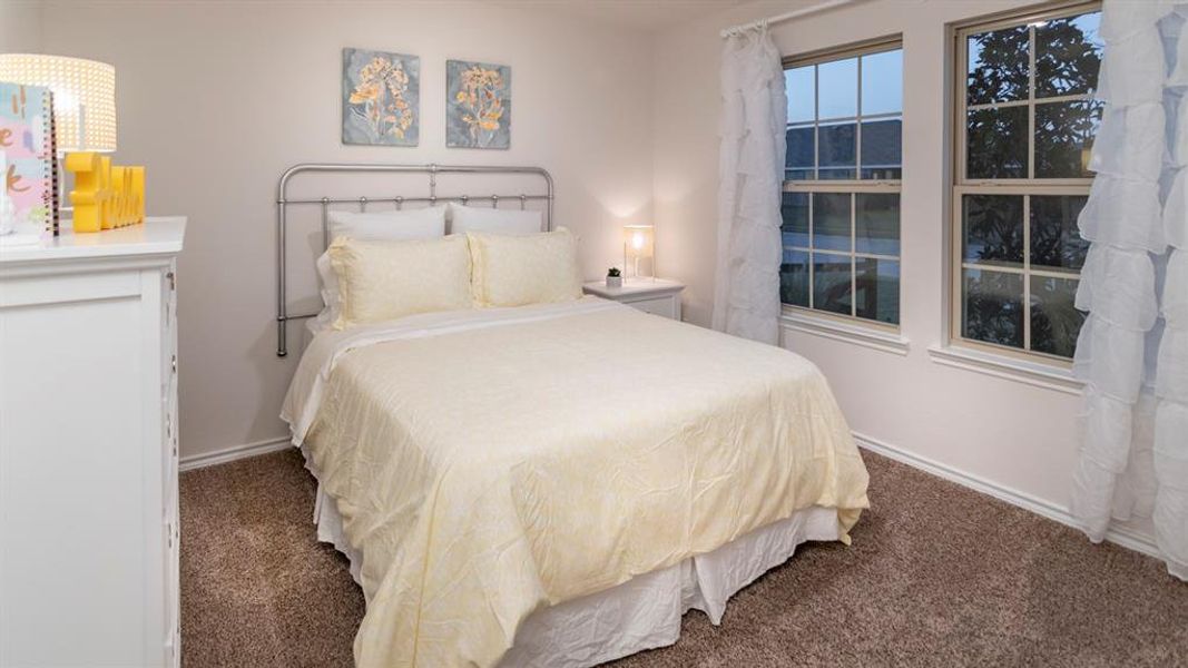 Bedroom with dark colored carpet