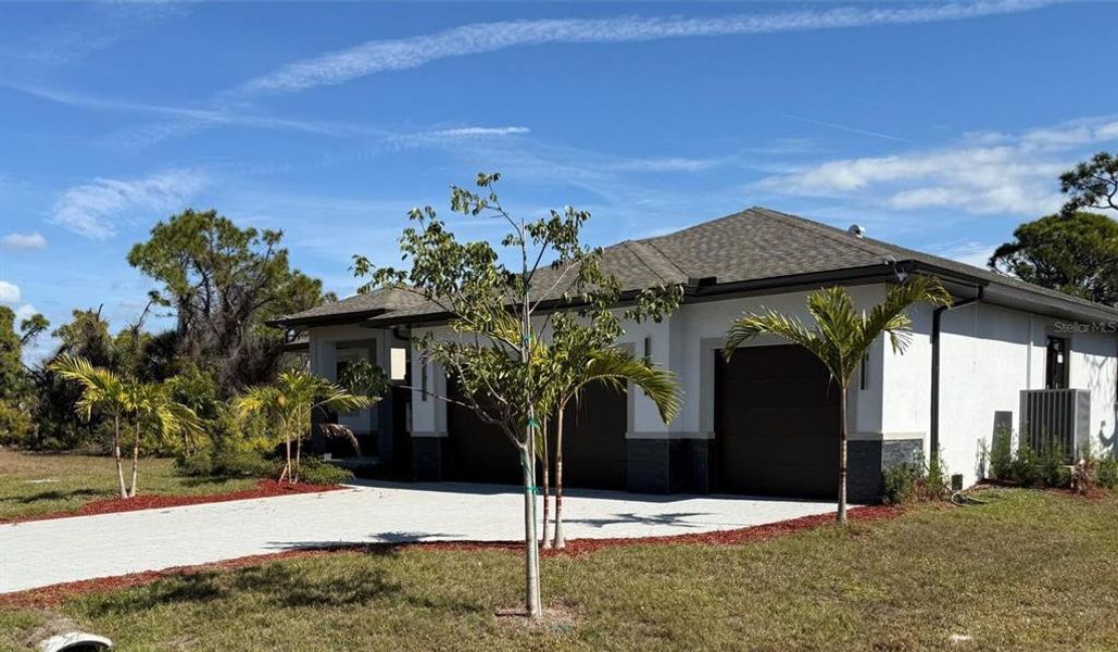Front exterior of a new home in , Placida, FL, highlighting curb appeal (Image 17).