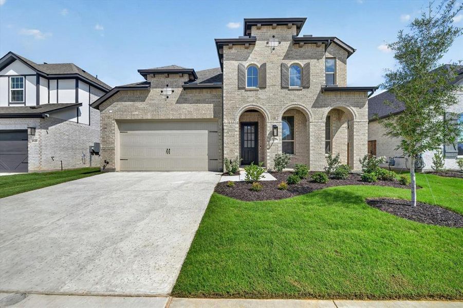 Front exterior of a new home in Wildflower Ranch, Dish, TX, highlighting curb appeal (Image 2). Front exterior of a new home in Wildflower Ranch, Dish, TX, highlighting curb appeal (Image 2).