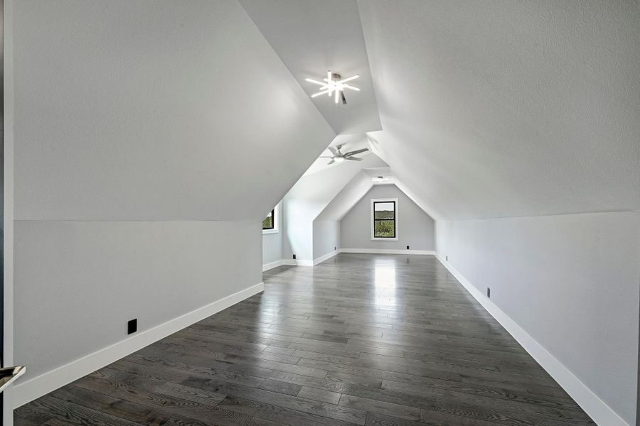 While the main floor also provides a dedicated home office with French doors (not pictured), upstairs you will also find this large bonus room. While the main floor also provides a dedicated home office with French doors (not pictured), upstairs you will also find this large bonus room.