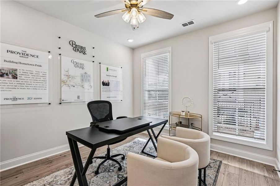 Terrace level bedroom is perfect space to finish out your Home office featuring light wood finished floors, a ceiling fan, and recessed lighting