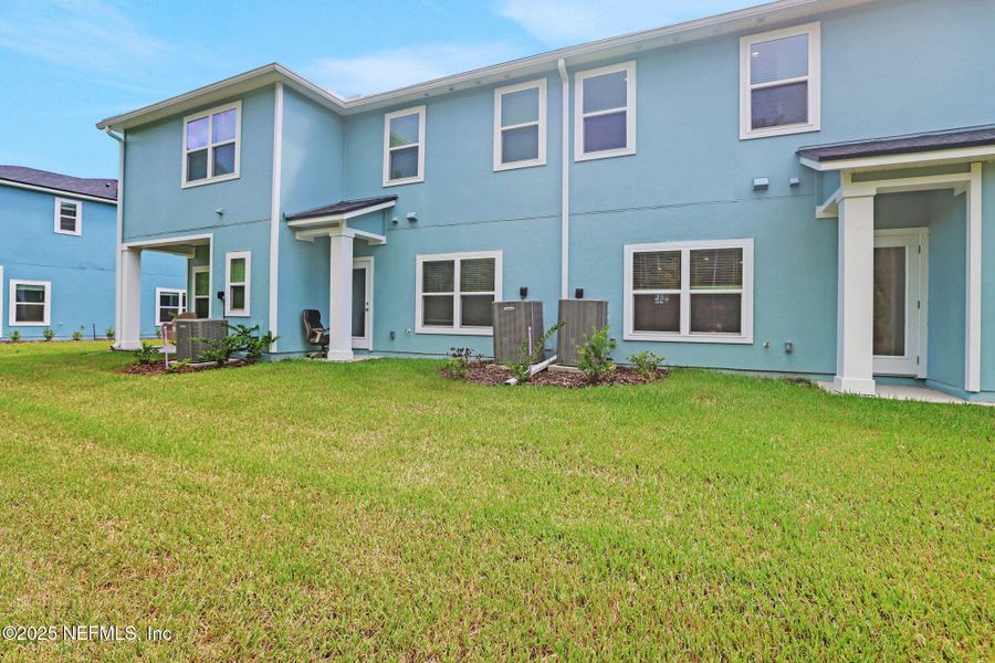 Front exterior of a new home in Atlantis Pointe, Middleburg, FL, highlighting curb appeal (Image 1).