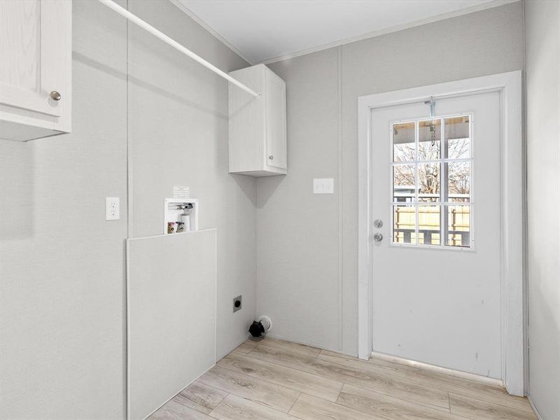 Wonderful laundry room with storage cabinets