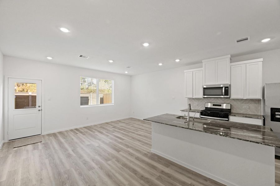 Furnished interior view inside a new home in Bridges on Lake Houston Villas, Humble (Image 5).