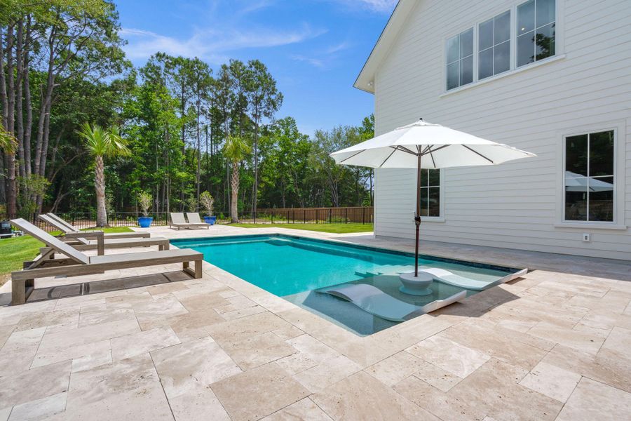 Exterior details and patio area of a home in , Johns Island (Image 40).